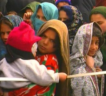 Afghan children in Kabul line up for aid administered by the U.S., U.K. and Canada.  Photo by Tim King Salem-News.com