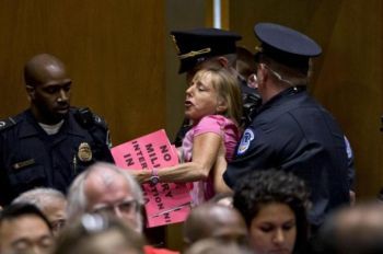 CODEPINK co-founder Medea Benjamin was removed by Capitol police during congressional hearings on Syria [AP].  