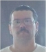 Tod Harvey is a white male, 5'10, 210 pounds, brown hair, brown eyes and a moustache. He wears glasses and has a scar on his right forearm.Photo: OSP